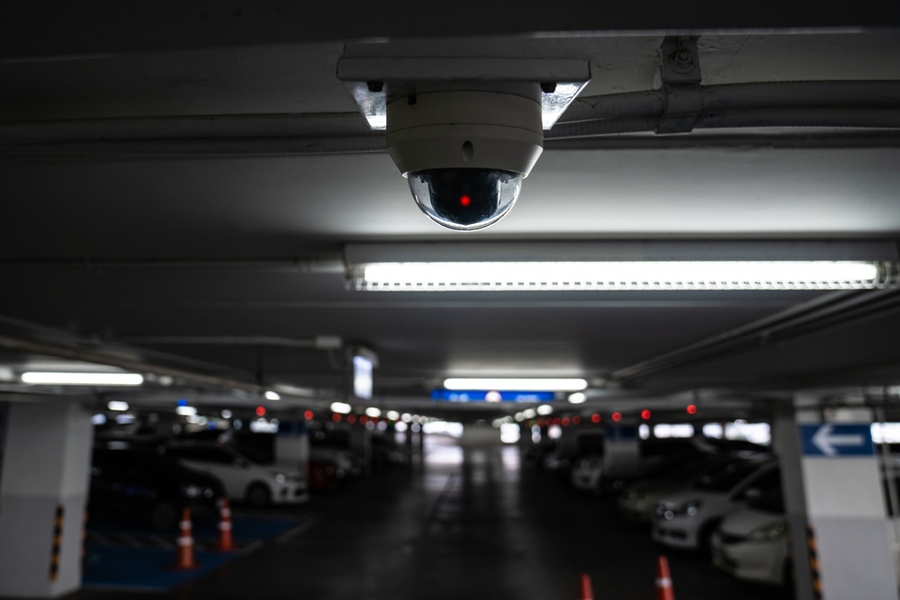 CCTV camera is installed on the car parking, ceiling for monitor and safety system control in dark low light atmosphere.